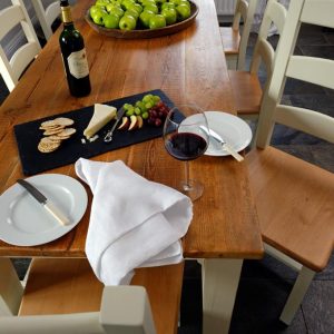 cheese, biscuits, red wine on reclaimed wood table