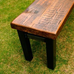 end of rustic bench with metal legs