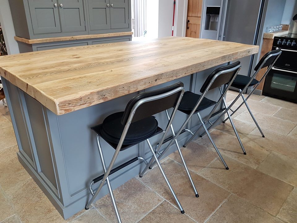 rustic wood kitchen island and breakfast chairs