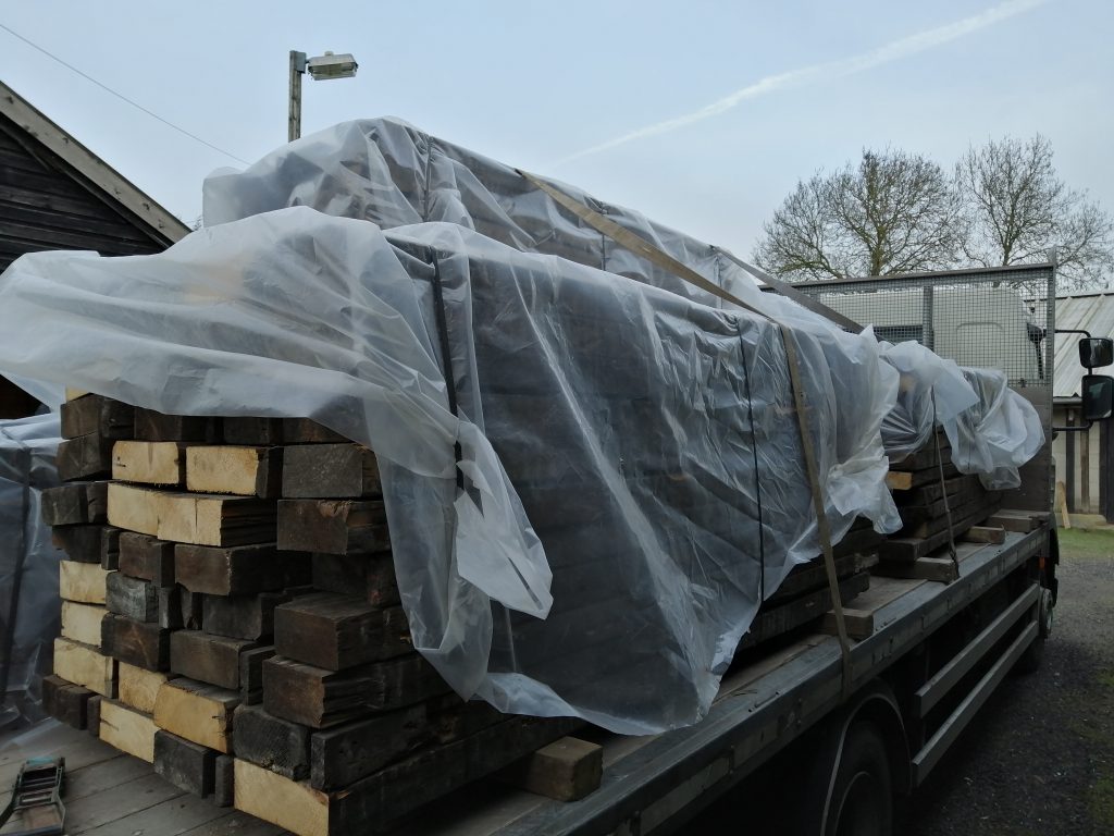 Reclaimed wood being delivered to our factory