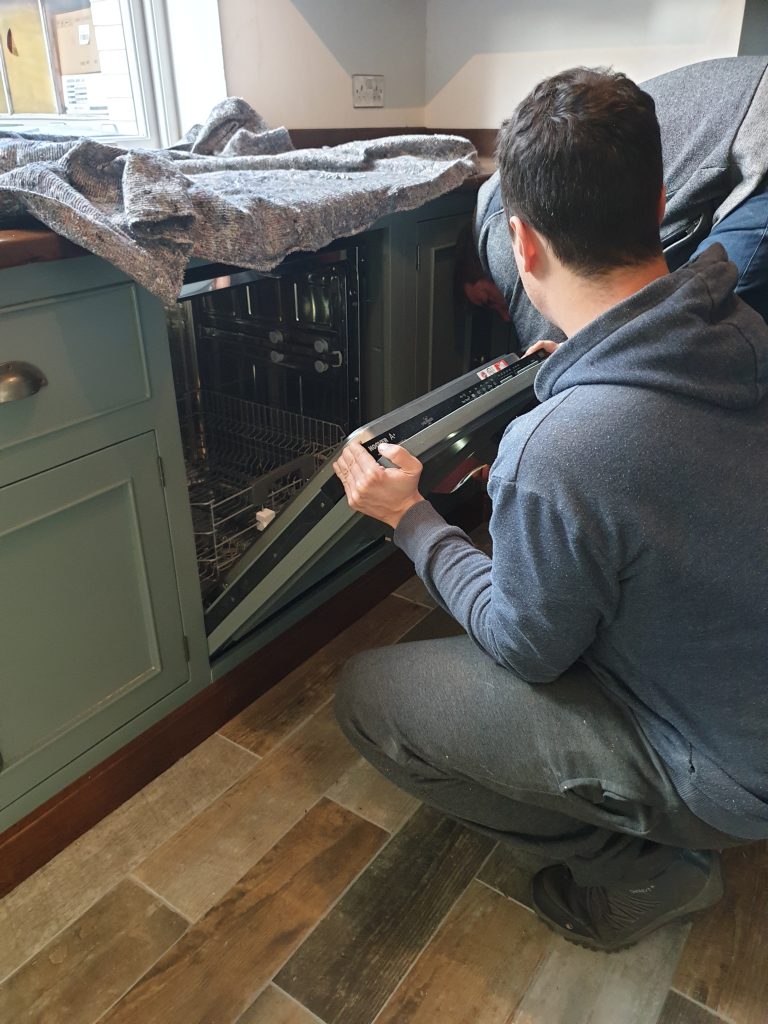 Integral Dishwasher is installed and fitted to reclaimed wood door and checked