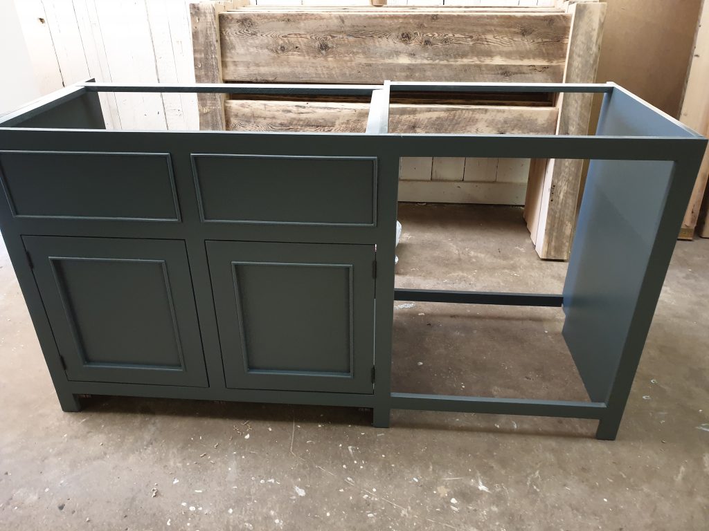 First kitchen unit made from reclaimed wood is painted up in chosen colour
