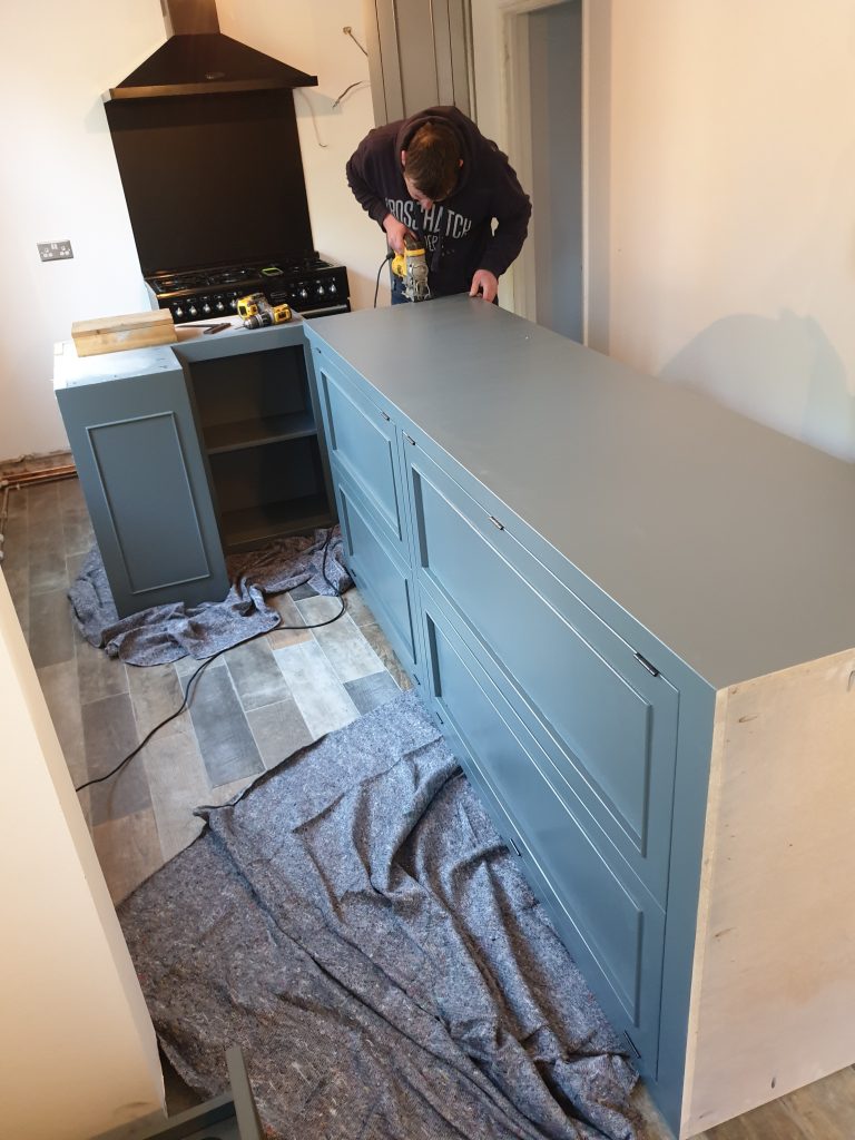 Making adjustments on site for pipes and skirting for a perfect fit