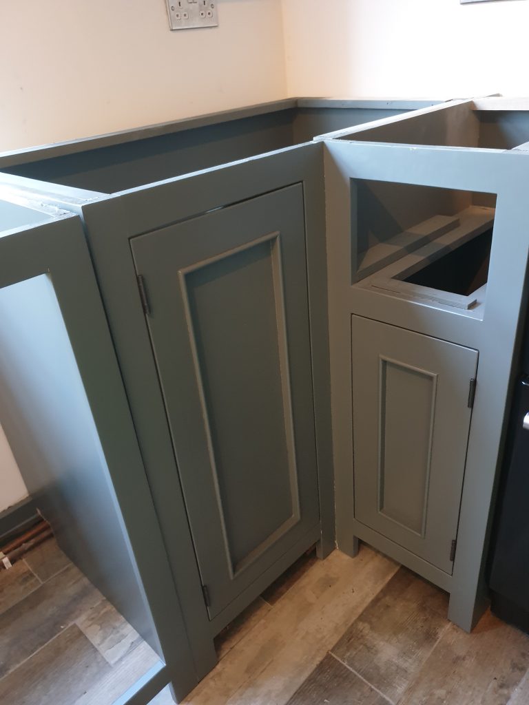 Rustic wood corner unit is fitted