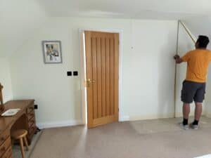A bespoke fitted wardrobe showing two doors with a panel design
