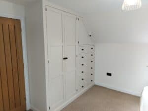 Bespoke fitted wardrobes in painted finish.